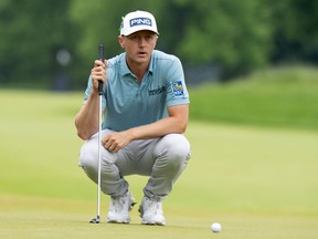 Mackenzie Hughes, of Dundas, Ont., lines up his putt on the 2nd hole in the final round of the Canadian Open in Hamilton, Ont., Sunday, June 2, 2024.