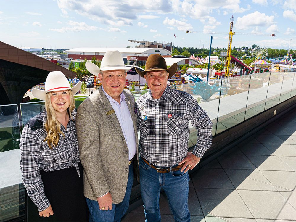 Tourism Calgary CEO Alisha Reynolds, Calgary Stampede CEO Joel Cowley, Calgary Economic Development President and CEO Brad Parry pose at the BMO Centre in Calgary on Thursday, July 4, 2024.