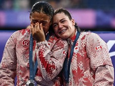 Canadian players celebrate with their silver medals on the podium during the victory ceremony following the women’s gold medal rugby sevens match between New Zealand and Canada in Saint-Denis on Tuesday.