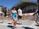 Concert-goers dance at the Calgary International Blues Festival at Millennium Park.