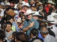 Prime Minister Justin Trudeau's summer campaign circuit will not include a stop at the Calgary Stampede. Trudeau attends a Stampede pancake breakfast in Calgary, Saturday, July 8, 2023.