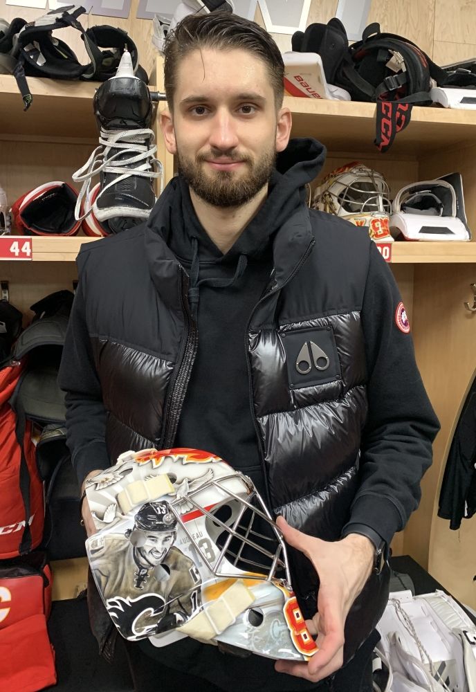  Flames goalie Dan Vladar shows off a special mask that pays tribute to Johnny and Matthew Gaudreau.