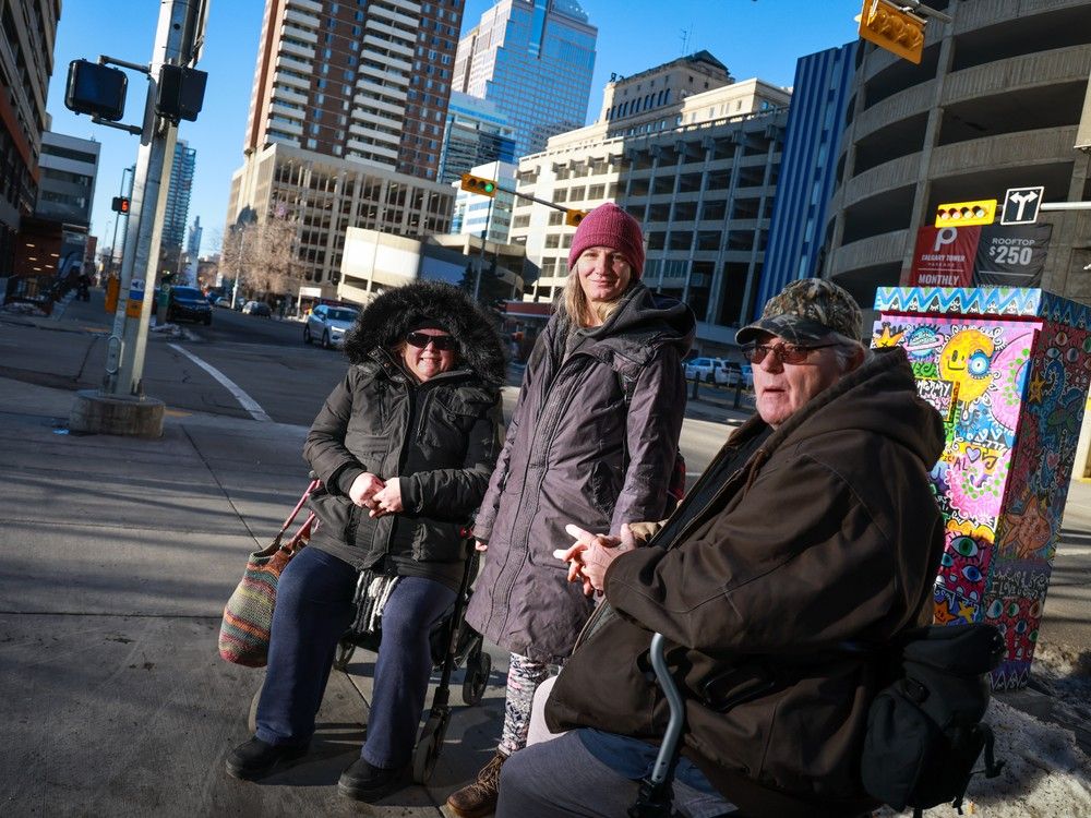 Lesley Boyer, Michelle Bennett and Dan McGinn share concerns about the plan for an above-ground CTrain line near their apartment building on 10th Avenue S.W.