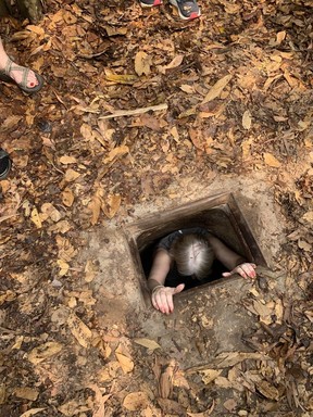Visitors to the Cu Chi tunnels near Saigon can climb down to get a sense of the depth and darkness. PHOTO BY MICHELE JARVIE