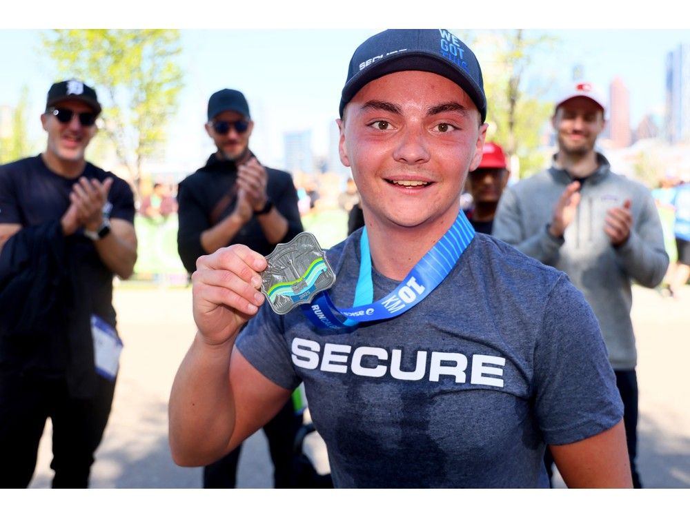  rylan laplante finishes the 10k after having been in a wheelchair for over 12 years.