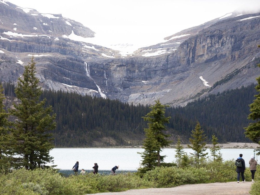  The site of Thursday’s fatal rock slide at Bow Glacier Falls can be seen beyond the shoreline of Bow Lake on Friday, June 20, 2025. Brent Calver/Postmedia