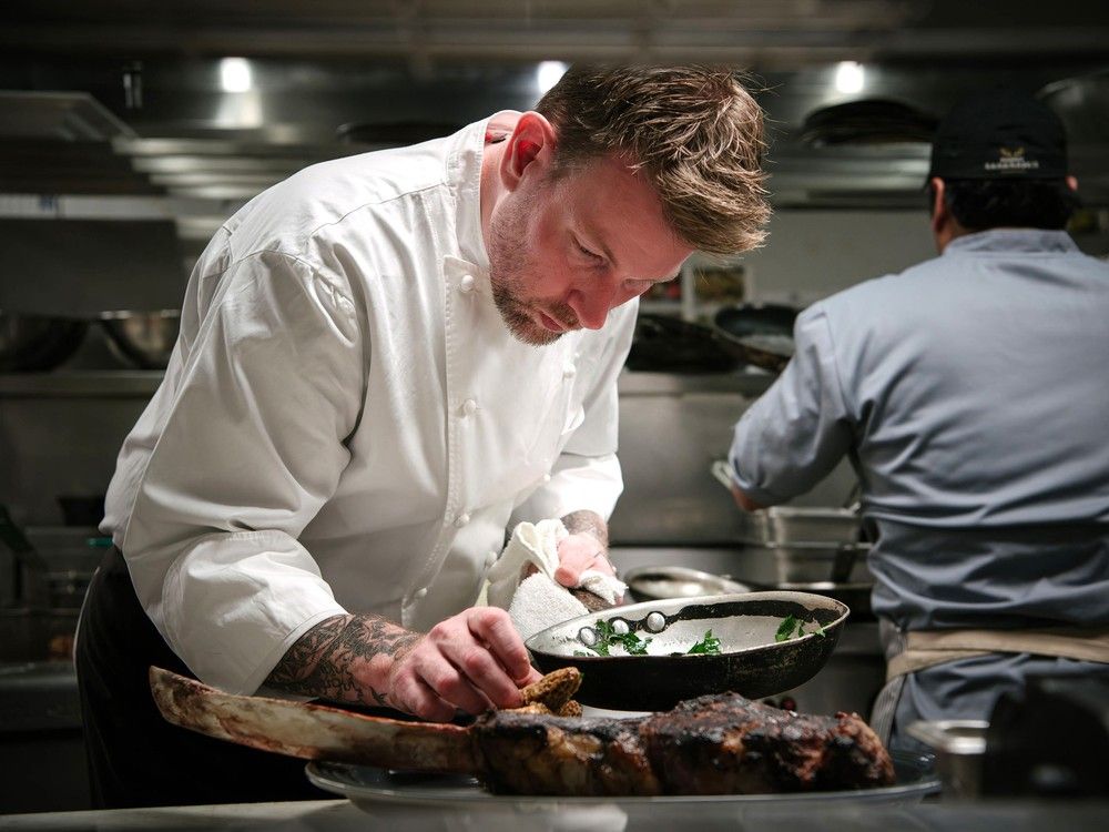  executive chef sebastien roelly is shown in the kitchen at the pomeroy kananaskis moutain lodge.