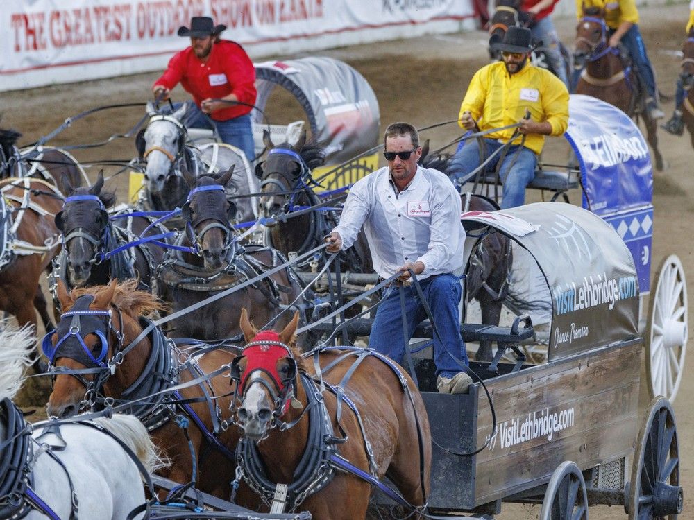 Chance Thomsen leads Chance Bensmiller and Chance Flad to the finish in Heat 3 of the Rangeland Derby chuckwagon races at the Calgary Stampede on July 14, 2024. Chance Thomsen leads Chance Bensmiller and Chance Flad to the finish in Heat 3 of the Rangeland Derby chuckwagon races at the Calgary Stampede on July 14, 2024.