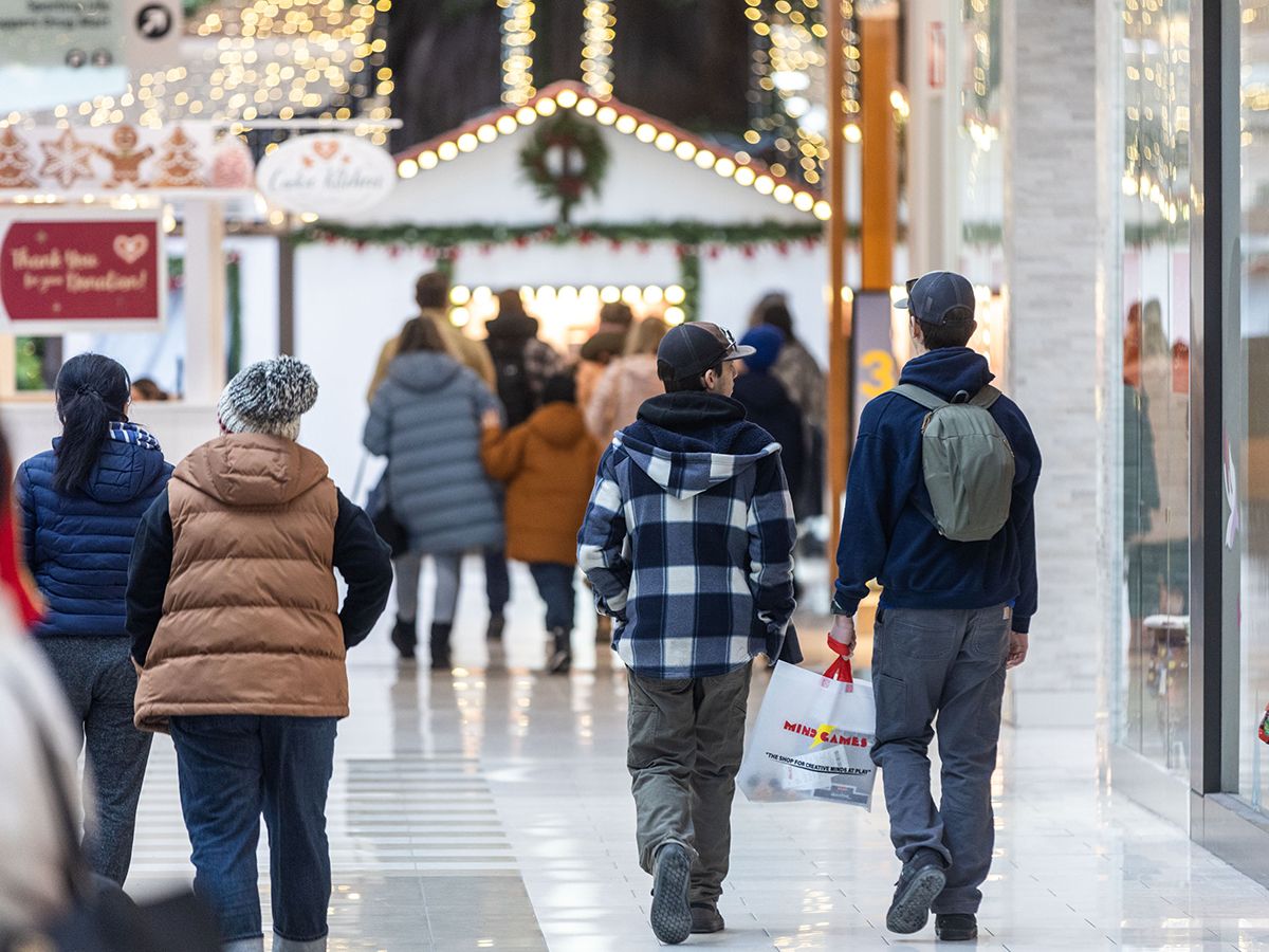 A quietness hung over one store in a Calgary mall as a few shoppers tried out its apparel in peace — but the real storm was coming.