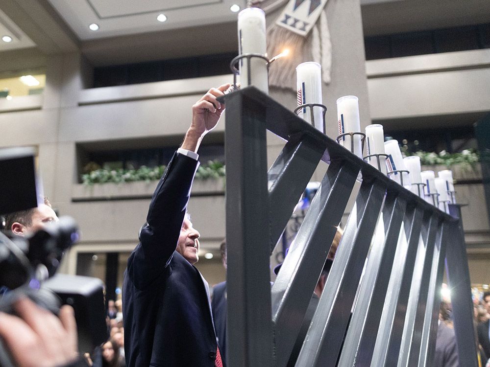 Emotions ran high as Calgarians gathered for the city's annual menorah lighting, held just one day after a terrorist attack in Australia.