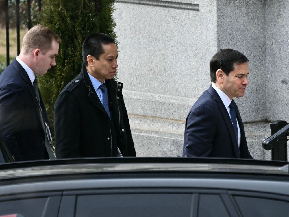U.S. Secretary of State Marco Rubio, right, arrives at the Eisenhower Executive Office Building on the White House campus ahead of a scheduled meeting with U.S. Vice President JD Vance, Danish Foreign Minister Lars Løkke Rasmussen and Greenland's Foreign Minister Vivian Motzfeldt in Washington, DC, on January 14, 2026.