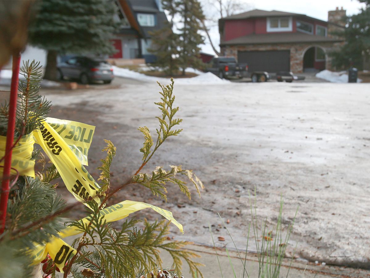  Police tape is all that is left at a house in the 0-100 block on Edgemont Court N.W. in Calgary on Tuesday, Jan. 13, 2026. The house, where an altercation occurred, is shown in the background. On the weekend an altercation occurred leaving a person dead at the scene. Police continue to investigate.