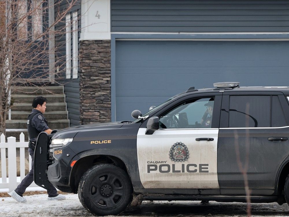 Calgary police are searching for clues after two people died in the northeast community of Redstone. 