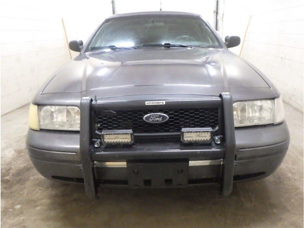 The suspect was driving a decommissioned police vehicle equipped with a fully functional siren and PA system.