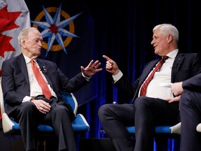 Former prime ministers Jean Chrétien and Stephen Harper speak at a Royal Canadian Geographical Society event in Ottawa on Feb. 2, 2026.