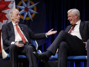 Former prime ministers Jean Chretien and Stephen Harper speak at a Royal Canadian Geographical Society event in Ottawa on Monday, Feb. 2, 2026.