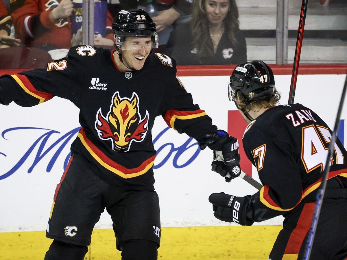 Calgary Flames' Ryan Strome, left, celebrates his goal with teammate Connor Zary during second period NHL hockey action against the Carolina Hurricanes in Calgary on Saturday, March 7, 2026.