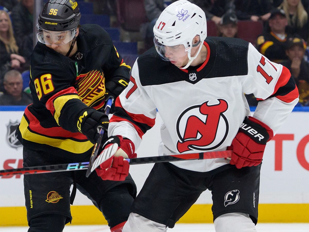 Simon Nemec #17 of the New Jersey Devils defends against Andrei Kuzmenko #96 of the Vancouver Canucks during the first period of their NHL game at Rogers Arena on Dec. 5, 2023 in Vancouver, British Columbia, Canada. The Calgary Flames traded for Nemec on June 23, 2026.