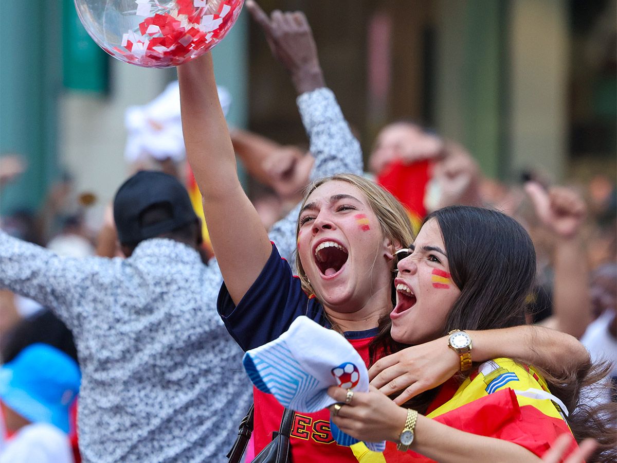 Soccer fans react to the crowning of a global champion following Sunday's FIFA World Cup final between Spain and Argentina.