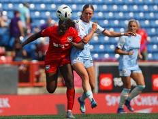 Calgary Wild FC #18, Serita Thurton, right, battles for possession against AFC Toronto's April Lantaigne during Northern Super League action at McMahon Saturday
