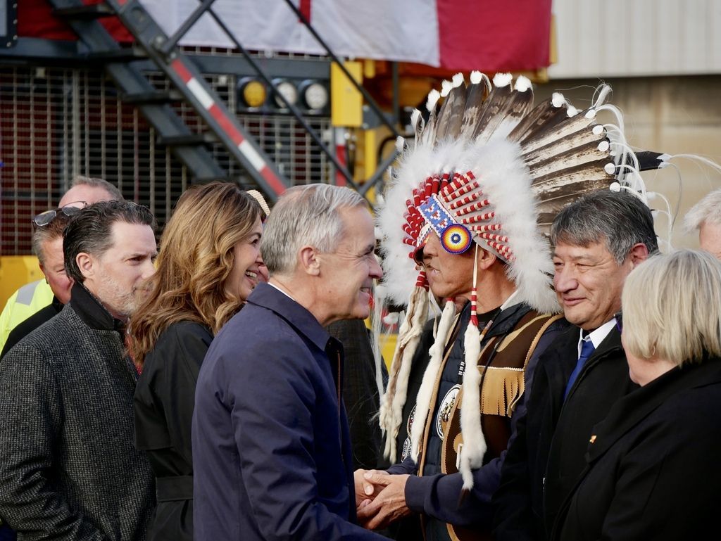 Prime Minister Mark Carney, Premier Danielle Smith and Pembina Pipeline Corporation president and CEO Scott Burrows greet dignitaries in Fort McMurray during an announcement relating to the Pacific Link pipeline being listed as a project of national interest, on Thursday, Oct. 1, 2026. Itoro Umanah/Postmedia