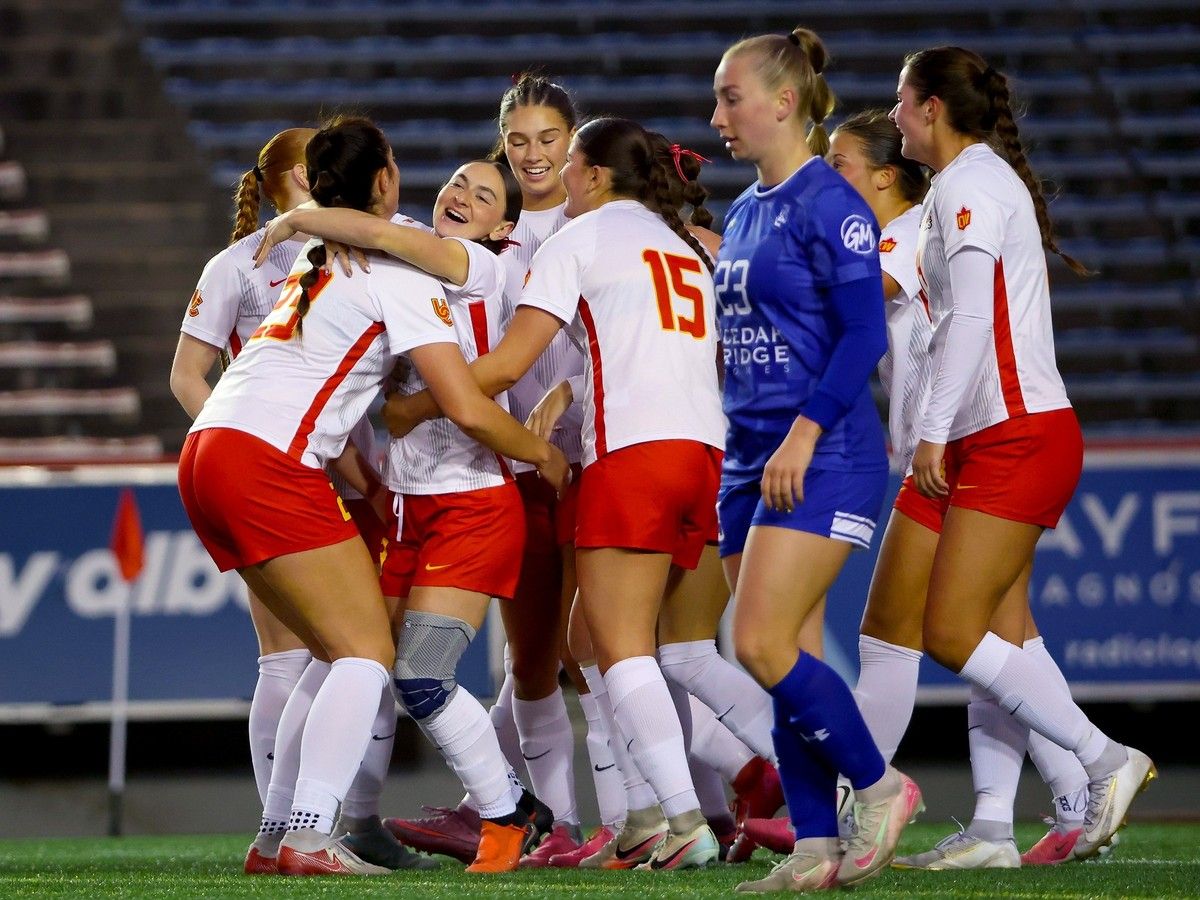 The Calgary Dinos women’s soccer team celebrates during a 3-0 win over the Lethbridge Proghorns at McMahon Stadium in Calgary on Nov. 15, 2026.