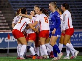 The Calgary Dinos women’s soccer team celebrates during a 3-0 win over the Lethbridge Proghorns at McMahon Stadium in Calgary on Nov. 15, 2026.