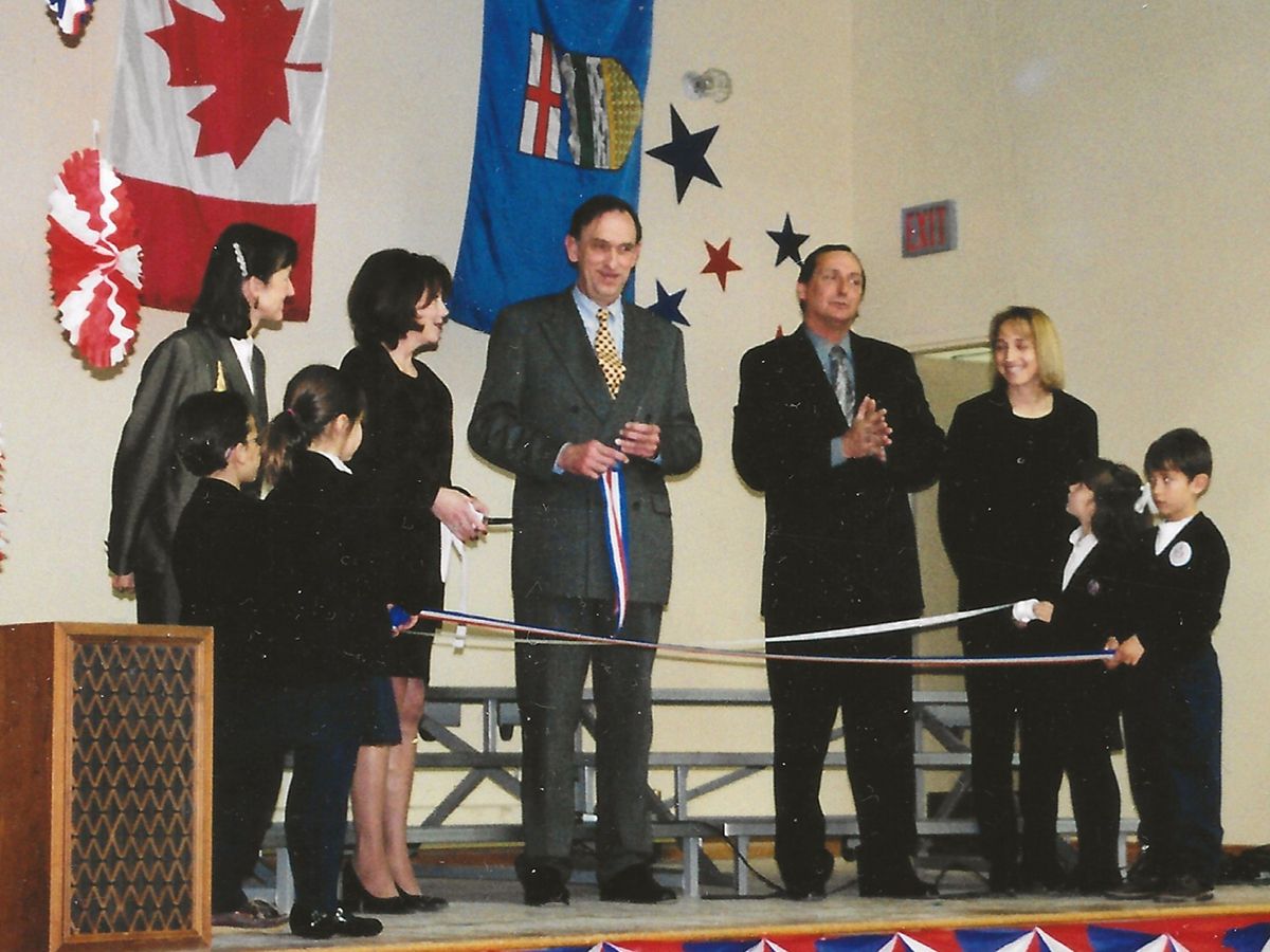 A November 2000 ribbon cutting marks the school’s move to its new location in Marda Loop. SUPPLIED