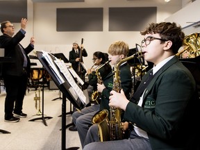 West Island College band director Jay Michalak leads students. SUPPLIED