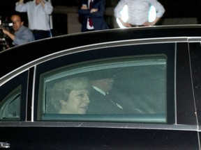 British Prime Minister Theresa May leaves after a meeting at EU headquarters in Brussels on Monday, Oct. 16, 2017. EU officials said that a meeting between British Prime Minister Theresa May and EU officials on Monday evening would span much more than the struggling Brexit talks to include current trade relations with global partners. (AP Photo/Virginia Mayo)