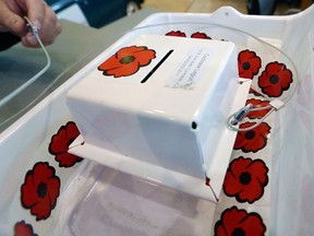 Cochrane resident Dan Kroffat is hoping the theft resistant poppy box he created last year will be used by more legions across the country. The metal box can be secured is secured with a metal cable. Gavin Young/Postmedia

Postmedia Calgary
Gavin Young, Postmedia
