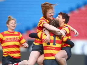 Members of the Calgary Dinos Women's Rugby team celebrate in Calgary on  Sunday, October 22, 2017 after defeating the Victoria Vikes 26-21 in the Canada West final. Jim Wells/Postmedia

Postmedia Calgary
Jim Wells, Jim Wells/Postmedia