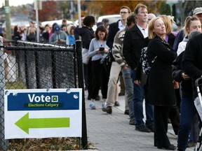 Hundreds of voters line up at Queen Elizabeth Elementary School on Monday.