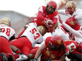 Calgary Dinos Josiah Joseph, top, goes for a touchdown against Laval during action at McMahon Stadium in Calgary, Alta.. on Saturday November 18, 2017. Leah hennel/Postmedia

POSTMEDIA CALGARY Dinos
Leah Hennel, Leah Hennel/Postmedia