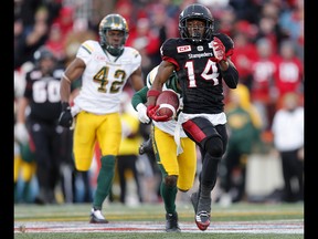 Calgary Stampeders Roy Finch runs by Edmonton Eskimos to score a touchdown during CFL Western Final action at McMahon Stadium in Calgary, Alta.. on Sunday November 19, 2017. Leah hennel/Postmedia