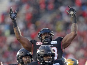 Calgary Stampeders Jerome Messam celebrates his touchdown on the Edmonton Eskimos during CFL Western Final action at McMahon Stadium on Nov. 19, 2017.