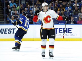 Calgary Flames' Mikael Backlund celebrates after scoring as St. Louis Blues' Jaden Schwartz, left, skates away during the first period on Wednesday, Oct. 25, 2017, in St. Louis.