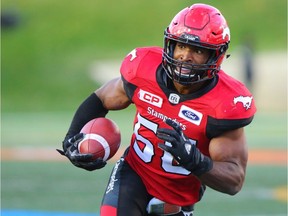 Calgary Stampeders linebacker Jameer Thurman runs the ball after making an interception against the BC Lions during CFL action at McMahon Stadium in Calgary on Saturday September 16, 2017.