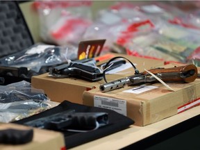 Drugs weapons and cash are displayed at a press conference in Calgary announcing a record $4 million drug seizure on Wednesday November 22, 2017.  Gavin Young/Postmedia

Postmedia Calgary
Gavin Young Gavin Young, Postmedia