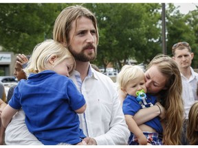 David Stephan, left, and Collet Stephan speak to supporters after arriving at the courthouse with their children in Lethbridge, Alta., Friday, June 24, 2016.