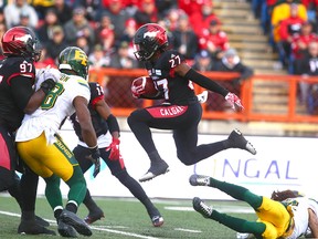 Stamps Tunde Adeleke (27) gets some air time during a return during the CFL Western Final in Calgary between the Calgary Stampeders and the Edmonton Eskimos on Sunday, November 19, 2017.  Jim Wells/Postmedia