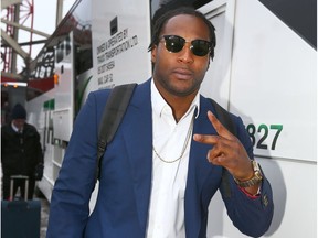 Calgary Stampeders RB Jerome Messam flashes a V as he boards the bus joins the team at McMahon Stadium in Calgary on  Tuesday, November 21, 2017 as they depart for the 105th Grey Cup in Ottawa.