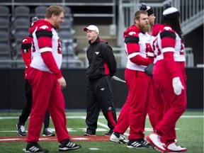 Calgary Stampeders head coach Dave Dickenson, centre, watches during practice ahead of the105th Grey Cup championship football game against the Toronto Argonauts in Ottawa on Saturday, November 25, 2017.