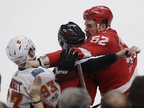 Sam Bennett, Jonathan Ericsson

Detroit Red Wings defenseman Jonathan Ericsson (52) throws a punch to Calgary Flames center Sam Bennett (93) as linesman Scott Driscoll (68) tries to separate during the third period of an NHL hockey game, Wednesday, Nov. 15, 2017, in Detroit. (AP Photo/Carlos Osorio) ORG XMIT: MICO113
Carlos Osorio, AP