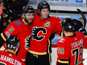 Calgary Flames star Sean Monahan celebrates with teammates after scoring against the New Jersey Devils in NHL hockey at the Scotiabank Saddledome in Calgary on Sunday, November 5, 2017.