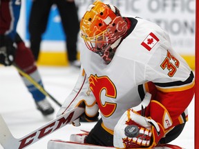Flames goalie David Rittich makes a glove-save off a shot in the first period of Saturday night’s game against the host Colorado Avalanche. The Flames got the 3-2 road victory in Denver.