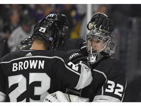 Los Angeles Kings goalie Jonathan Quick, right, celebrates with right wing Dustin Brown after the Kings defeated the Toronto Maple Leafs 5-3 in an NHL hockey game, Thursday, Nov. 2, 2017, in Los Angeles.