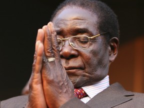 In this Wednesday, Aug. 29, 2007 file photo President Robert Mugabe is seen at the Zanu PF headquarters in Harare