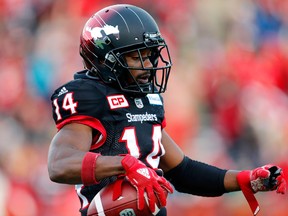 Calgary Stampeders Roy Finch, right, celebrates his touchdown on Edmonton Eskimos during West Final action at McMahon Stadium on Nov. 19, 2019