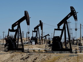 This June 24, 2015 file photo shows pumping Jacks at the Chevron section of the Kern River Oil Field near Bakersfield, California.